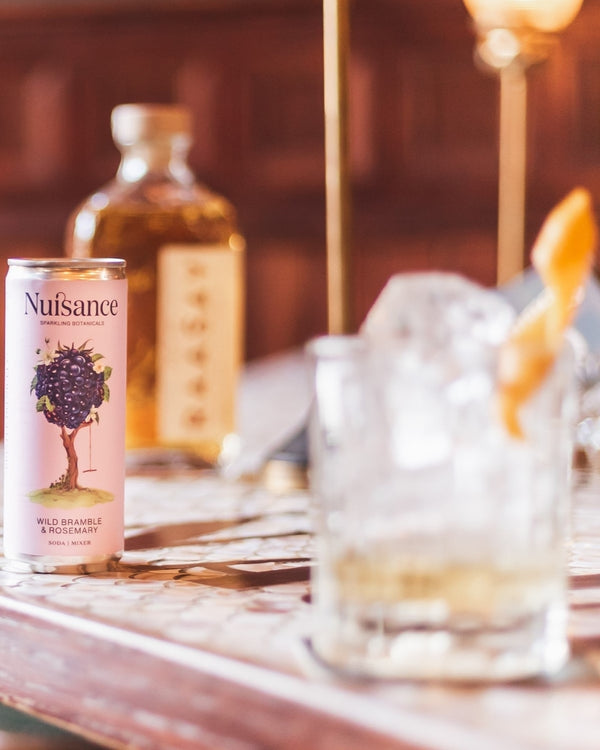 A cold refreshing cocktail of whisky, Lemon Juice, sugar syrup and topped with refreshing can of premium Bramble and Rosemary botanical soft drink from Scotland-based drinks start-up brand  Nuisance drinks.