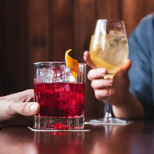 Patrons drinking cocktails made with Nuisance premium botanical soft drinks in the cover of the article about dry january