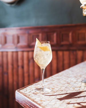 A cold Refreshing glass with  cocktail of British Vermouth mixed with a  Premium Nettle and Elderflower botanical drink from Scotland-based drinks start-up brand Nuisance drinks