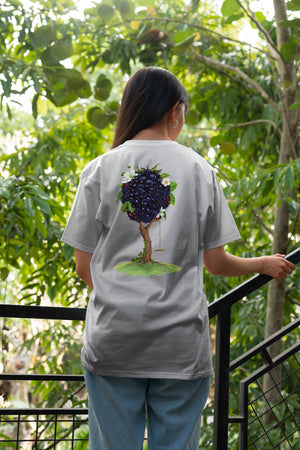 woman wearing a nuisance drinks t-shirt with bramble illustration